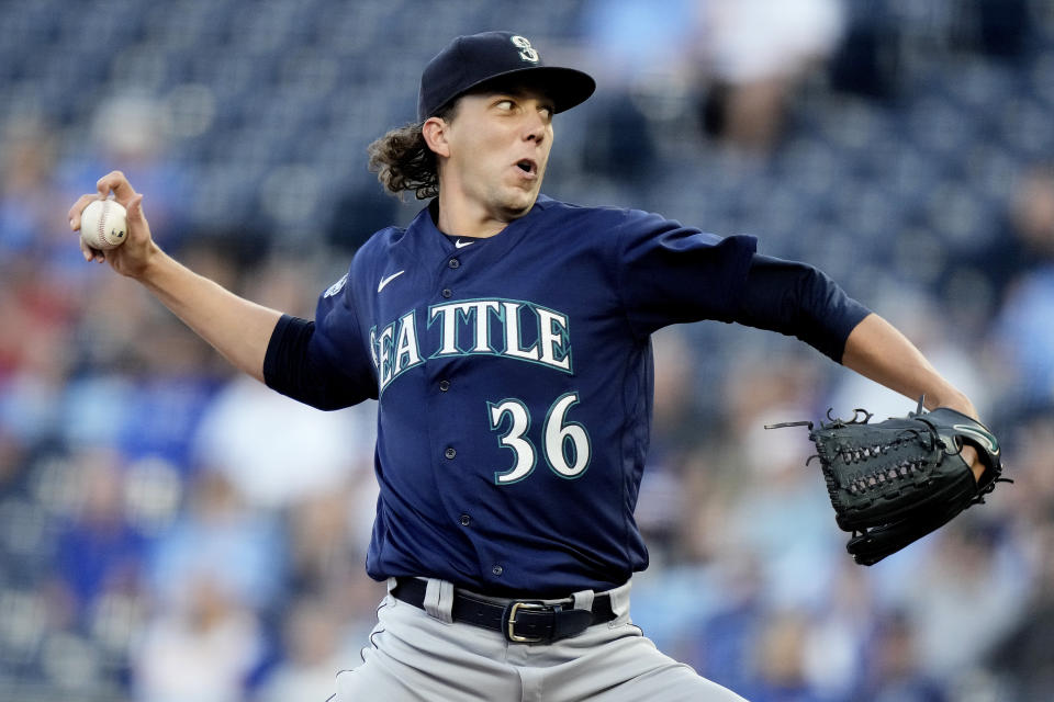 Seattle Mariners starting pitcher Logan Gilbert throws during the first inning of a baseball game against the Kansas City Royals Monday, Aug. 14, 2023, in Kansas City, Mo. (AP Photo/Charlie Riedel)