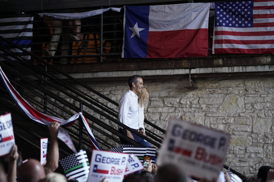 Texas Land Commissioner George P. Bush arrives for a kick-off rally with his wife Amanda to announced he will run for Texas Attorney General, Wednesday, June 2, 2021, in Austin, Texas. (AP Photo/Eric Gay)