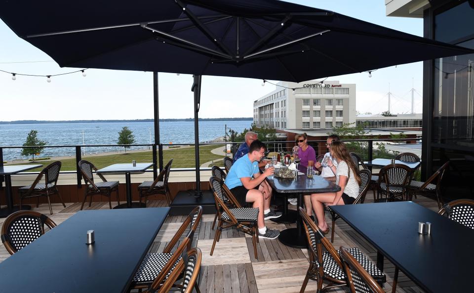 The Pier 6 Rooftop Bar & Restaurant shown June 29, 2021, offers diners a view of Presque Isle Bay. Pier 6 is the latest venture by John Melody and Russell Stachewicz, who also own the U Pick Six bars.