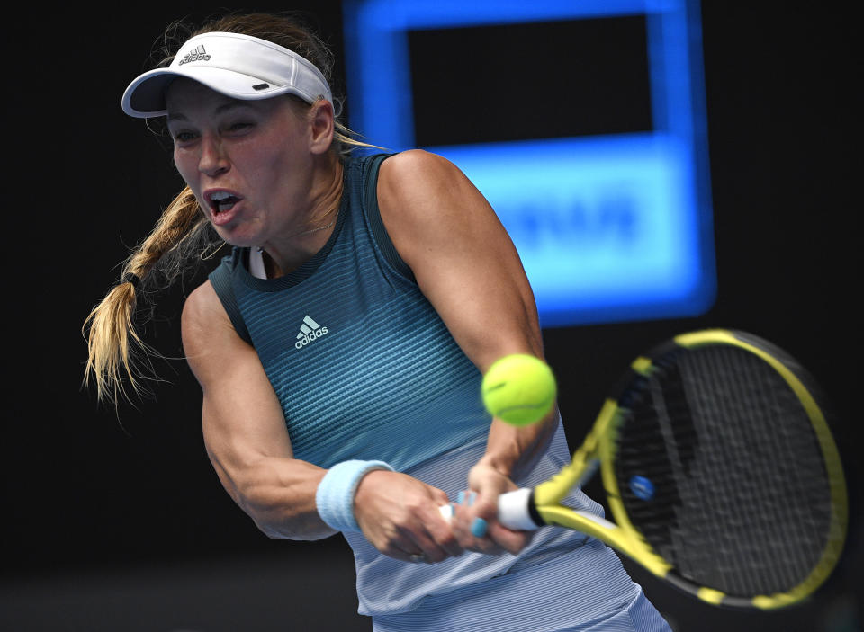 Denmark's Caroline Wozniacki makes a backhand return to Sweden's Johanna Larsson during their second round match at the Australian Open tennis championships in Melbourne, Australia, Wednesday, Jan. 16, 2019. (AP Photo/Andy Brownbill)