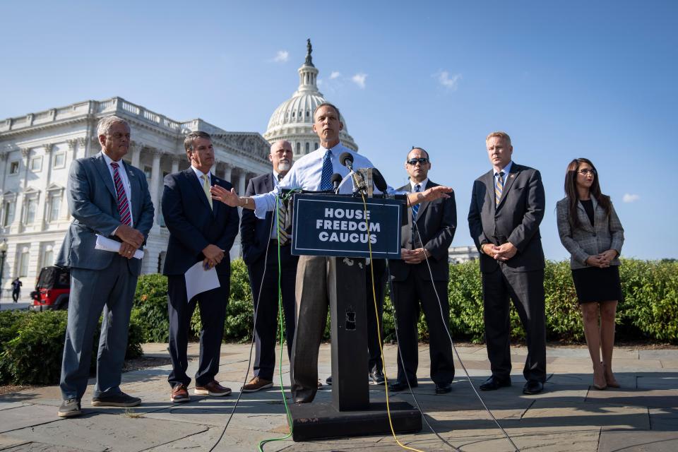 Surrounded by members of the U.S. House Freedom Caucus, Rep. Scott Perry (R-PA) speaks at a news conference on Capitol Hill September 15, 2022 in Washington, DC.