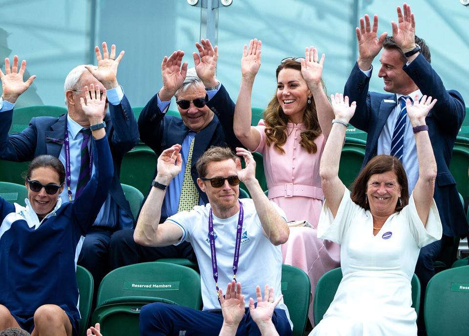 Catherine, Duchess of Cambridge is seen in the stands taking part in a Mexican wave during Day Thirteen of The Championships - Wimbledon 2021 at All England Lawn Tennis and Croquet Club on July 11, 2021 in London, England.