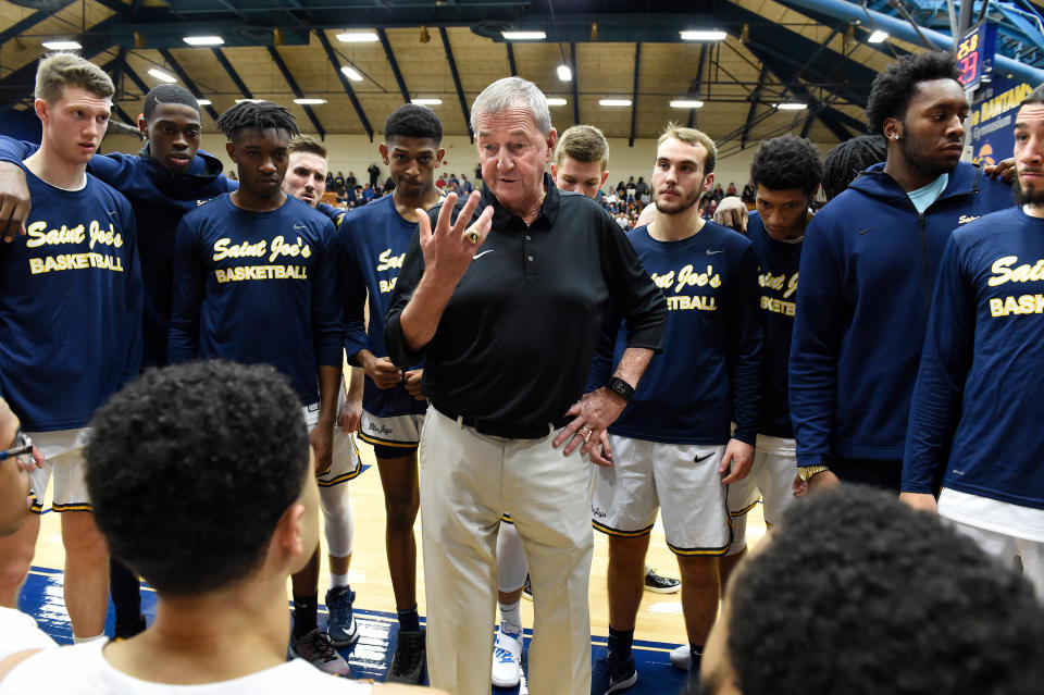 Former UConn basketball coach Jim Calhoun talks to his team before tip-off in his debut as the coach of the University of St. Joseph Blue Jays in their opening game of the 2018 season. (Cloe Poisson/Tribune News Service/Getty Images)