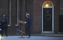 Prime Minister Theresa May makes a statement in Downing Street, London, confirming there will be a vote of confidence in May's leadership of the Conservative Party, Wednesday Dec. 12, 2018. The vote of confidence will be held in Parliament Wednesday evening, with the result announced soon after. (Kirsty O'Connor/PA via AP)