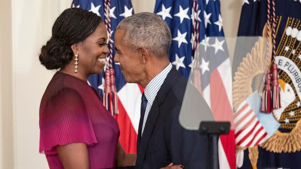 PHOTO: Former First Lady Michelle Obama and former U.S. President Barack Obama embrace at a ceremony to unveil their official White House portraits at the White House on Sept. 7, 2022. (Kevin Dietsch/Getty Images, FILE)