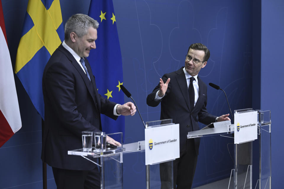 Karl Nehammer, Chancellor of Austria, left, and Ulf Kristersson, Prime Minister of Sweden, attend a press conference following their talks in Stockholm, Sweden, Thursday, March 30, 2023. (Jessica Gow/TT News Agency via AP)