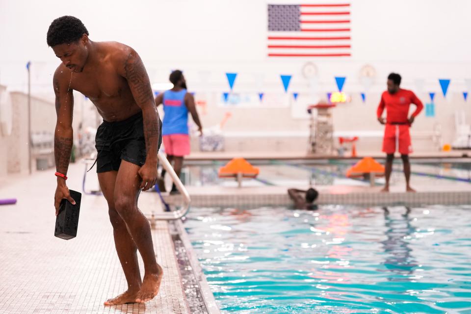 Ja'Lin Goodman steps out of the pool after swimming about 20 yards with a 10-pound diving brick as part of a pre-test during a new lifeguard testing and training session at the Columbus Aquatics Center in 2022. The city has plans to build a second indoor pool at the site of Mifflin Middle School in partnership with Columbus City Schools.