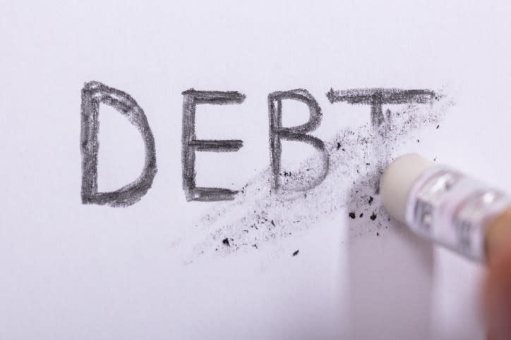 The word "debt" being erased