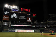 The scoreboard shows an image of the George Floyd after a baseball game between the Washington Nationals and the St. Louis Cardinals, Tuesday, April 20, 2021, in Washington. The Nationals won 3-2. (AP Photo/Nick Wass)