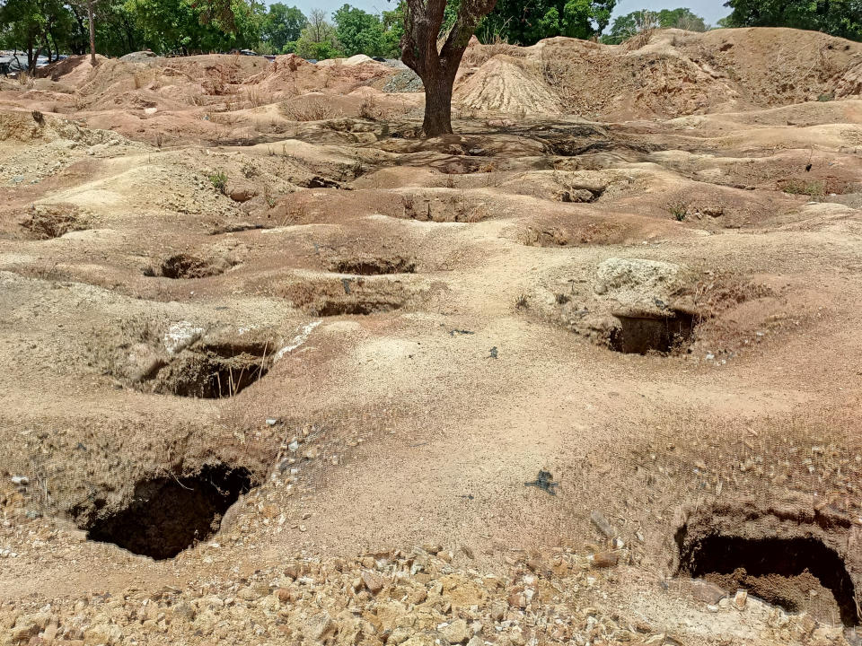 Artisanal gold mining pits are seen at a mining site near Dano, southern Burkina Faso May 5, 2020. Picture taken May 5, 2020. REUTERS/Moussa Bouboucari