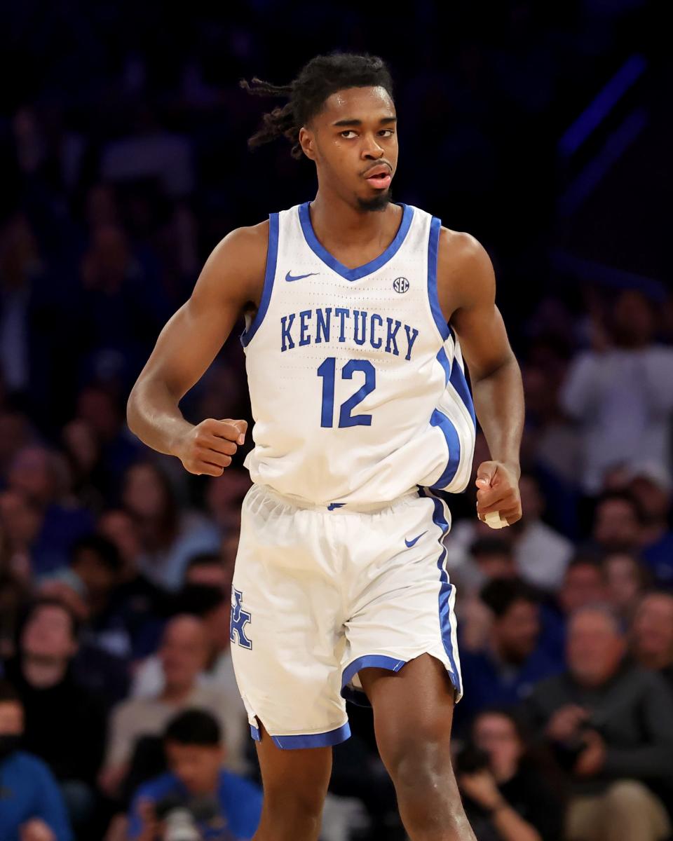 Dec 17, 2022; New York, New York, USA; Kentucky Wildcats guard Antonio Reeves (12) reacts after a three point shot against the UCLA Bruins during the first half at Madison Square Garden. Mandatory Credit: Brad Penner-USA TODAY Sports