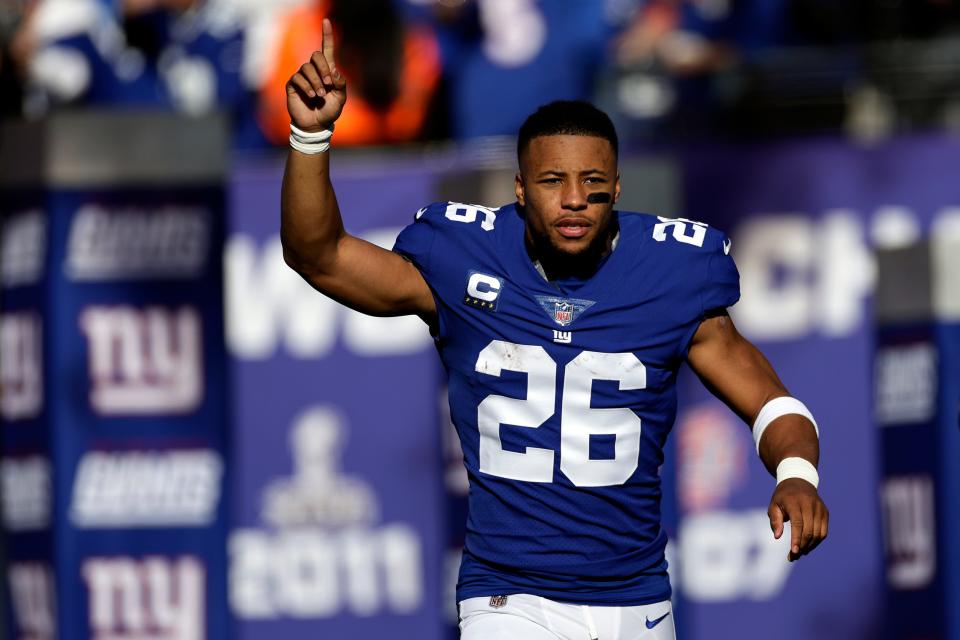 New York Giants running back Saquon Barkley (26) is introduced before an NFL football game against the Indianapolis Colts on Sunday, Jan. 1, 2023, in East Rutherford, N.J. (AP Photo/Adam Hunger)