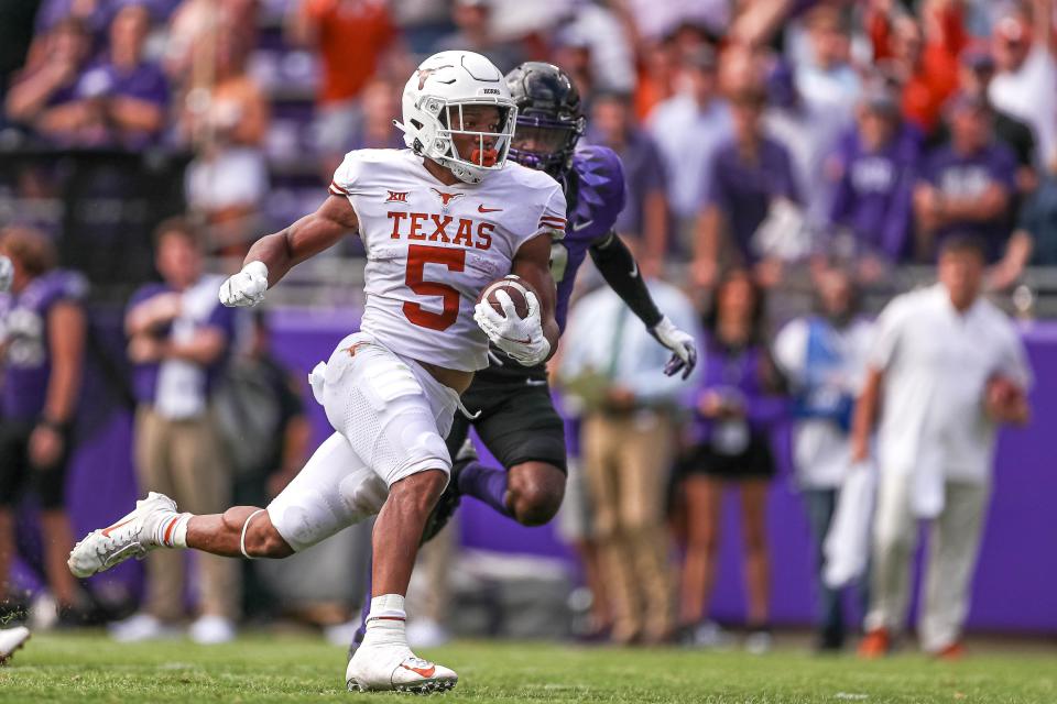 Texas running back Bijan Robinson runs the ball vs. Texas Christian University at Amon G. Carter Stadium in Fort Worth, Texas on Oct. 2, 2021.