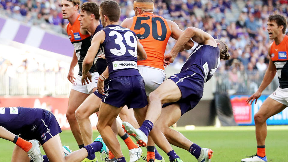 Nat Fyfe, pictured here copping a brutal hit from Sam Reid in Fremantle's win over GWS.