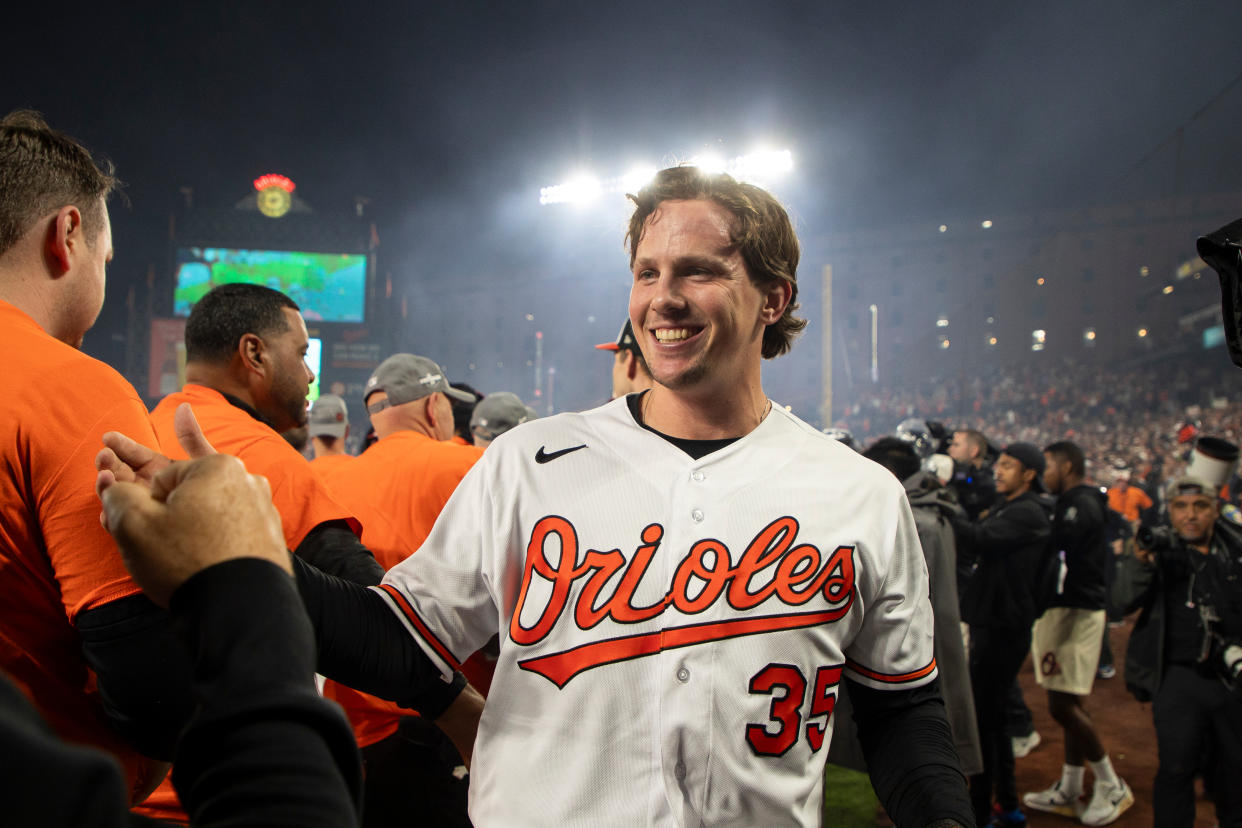 BALTIMORE, MARYLAND - SEPTEMBER 28: Adley Rutschman #35 of the Baltimore Orioles celebrates with staff on the field after the Orioles defeated the Boston Red Sox to win the American League East at Oriole Park at Camden Yards on September 28, 2023 in Baltimore, Maryland. (Photo by Brandon Sloter/Image Of Sport/Getty Images)