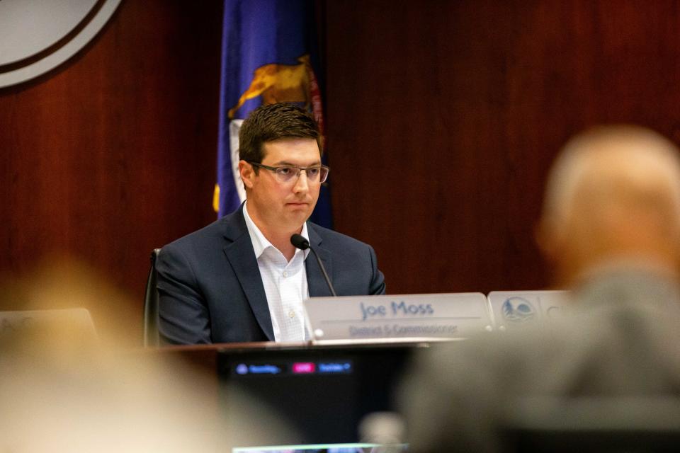 Joe Moss listens as members of the public give comment  Tuesday, June 27, 2023, at the Ottawa County Offices in West Olive. 