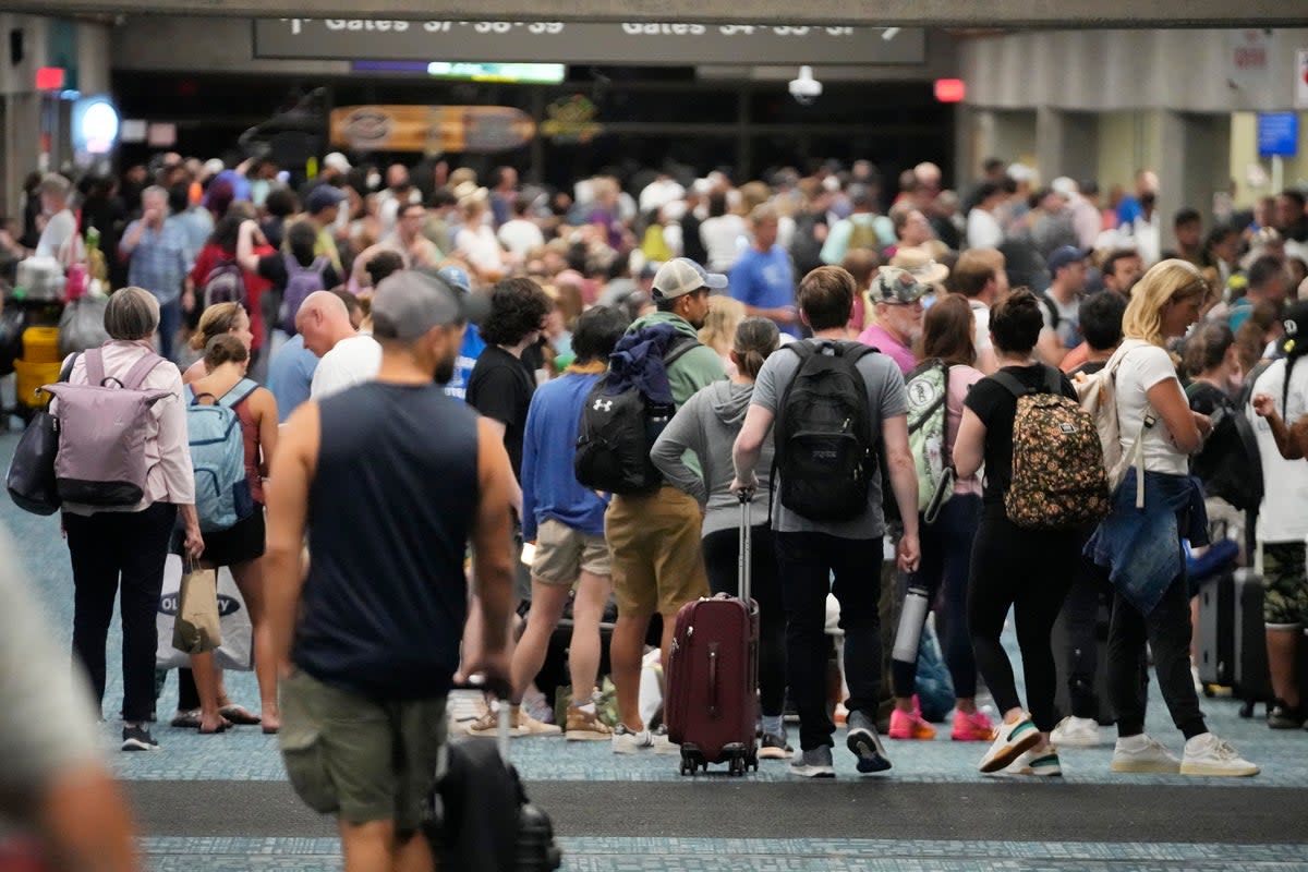 People waiting for flights crowd into Kahului Airport (AP)