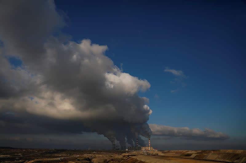 FILE PHOTO: Smoke and steam billows from Belchatow Power Station, Europe's largest coal-fired power plant operated by PGE Group, near Belchatow