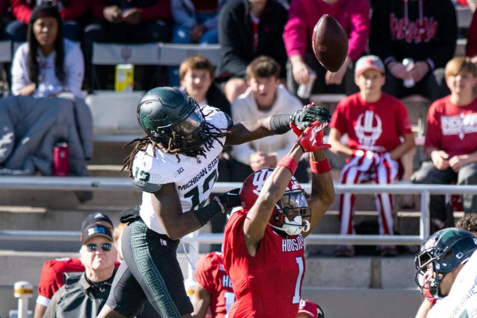 Michigan State defensive back Chester Kimbrough breaks up a pass intended for Indiana wide receiver Donaven McCulley during the game on Saturday, Nov. 18, 2023, in Bloomington, Indiana.