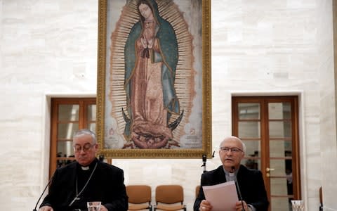Chilean bishops Luis Fernando Ramos Perez and Juan Ignacio Gonzalez Errazuriz read statements during a news conference after a meeting with Pope Francis at the Vatican - Credit: Max Rossi/Reuters