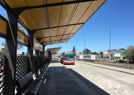 A bus arrives at a soon-to-be completed bus lane in the working-class district of La Matanza, in Buenos Aires province, Argentina April 26, 2017. REUTERS/Luc Cohen