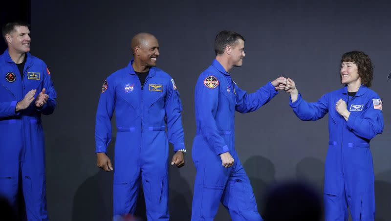 From left, Jeremy Hansen, Victor Glover, Reid Wiseman and Christina Hammock Koch, celebrate on stage as they are announced as the Artemis II crew during a NASA ceremony naming the four astronauts who will fly around the moon by the end of next year, at a ceremony held in the NASA hangar at Ellington airport Monday, April 3, 2023, in Houston. 