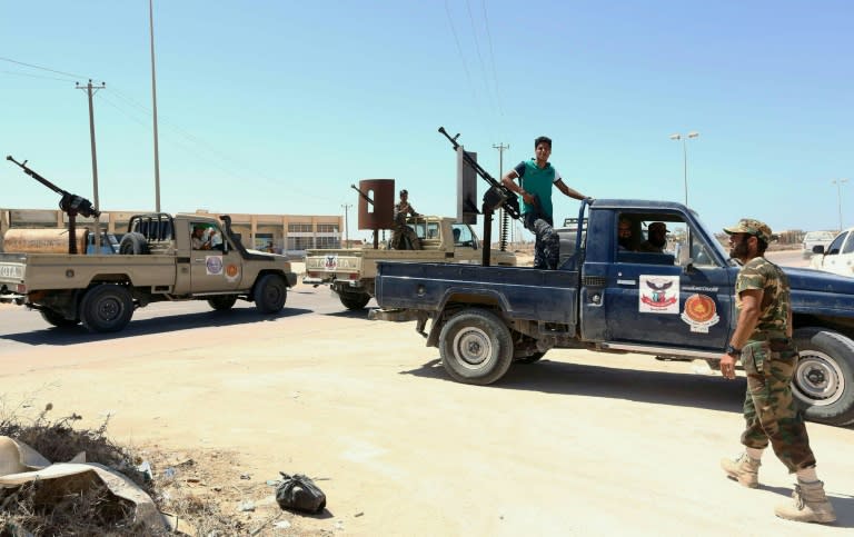 Forces loyal to Libya's UN-backed Government of National Accord (GNA) stand in Sirte, east of the capital Tripoli, as they comb through some residential neighbourhoods that were previously controlled by Islamic State group on August 22, 2016