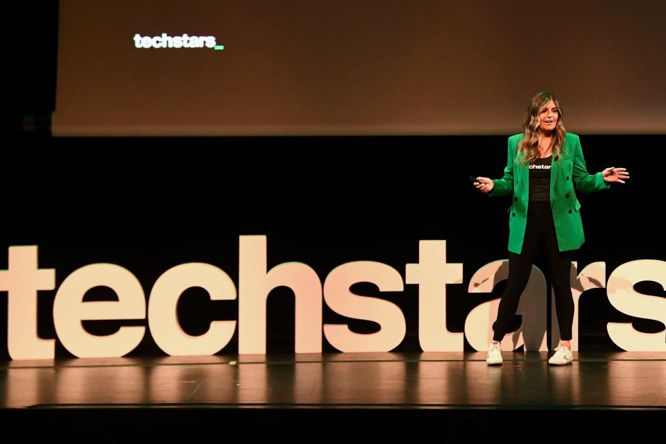 Techstars Managing Director Tricia Martinez welcoms guests to the Techstars Industries of the Future Demo Day at at the University of Tennessee Student Union Auditorium in Knoxville, Tenn. on Thursday, May 26, 2022. 