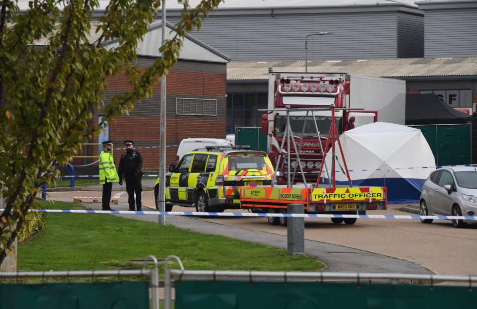 Police gather at the site where 39 bodies were found inside a truck container at Waterglade Industrial Park in Grays, United Kingdom, on Oct. 23, 2019.