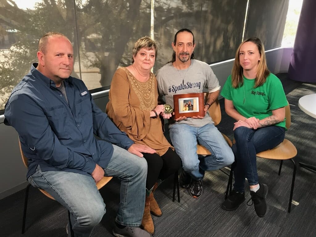 Kristi Richard Russ (second from left) received a heart from Matthew, the 21-year-old late son of Jordan Spahn (second from right). The two families, including Kristi's husband Ron (L) and Spahn's fiancée Summer Mossbarger (R), united to hear Matthew's heart with a stethoscope. (Photo: Courtesy of Jordan Spahn)