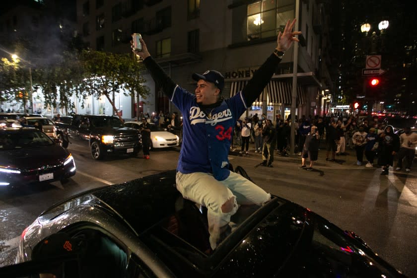 Fans celebrate after the Los Angeles Dodgers defeated the Tampa Bay Rays in game 6