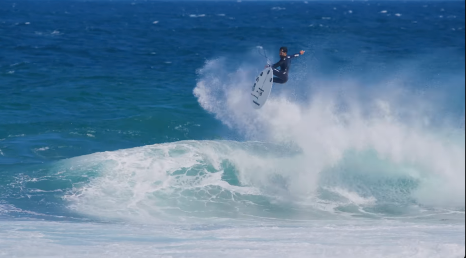 Italo Ferreira casually stomped this first attempt on John Florence's backup board. <p>Frame: Erik Knuston</p>