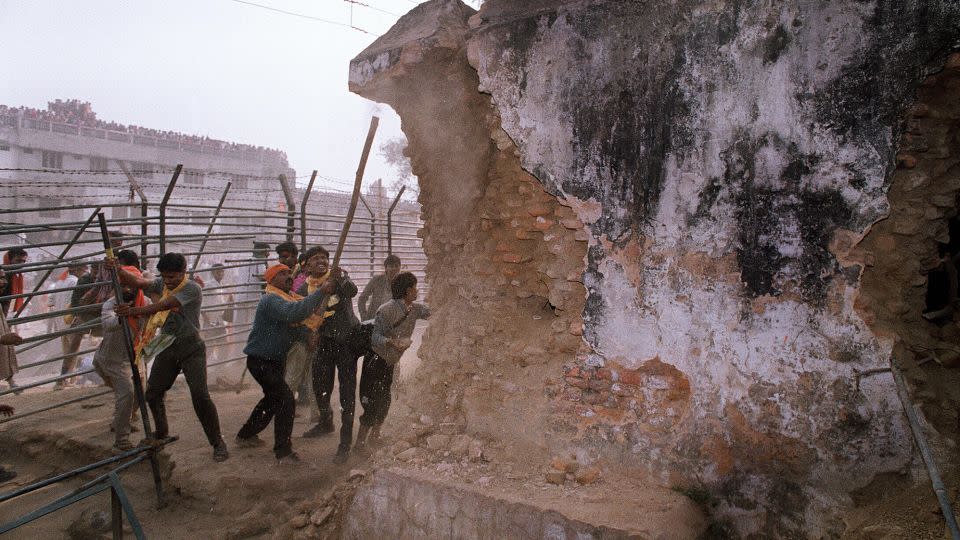 Hindu fundamentalists demolish the wall of the 16th century Babri Masjid mosque in the city of Ayodhya in 1992.  - Douglas E. Curran/AFP/Getty Images