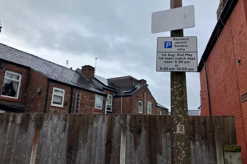 Parking permit signs around Edgeley Park.