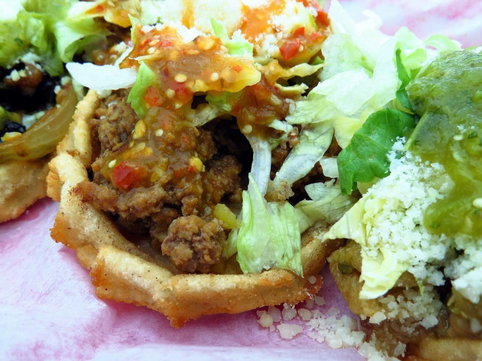 Sopes are crisp, hand-formed corn masa boats filled with beans, meat and toppings.