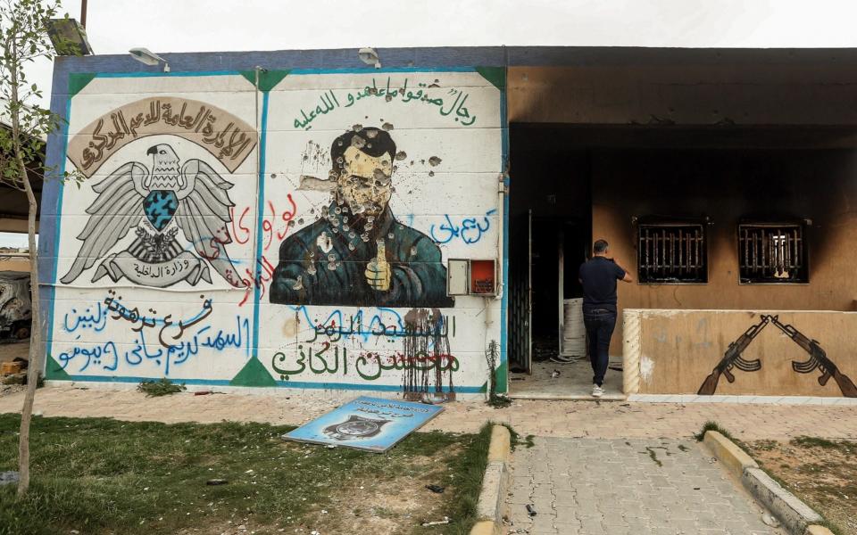 A mural depicting Mohsen al-Kania a commander of forces loyal Libya's eastern strongman Khalifa Haftar - AFP 