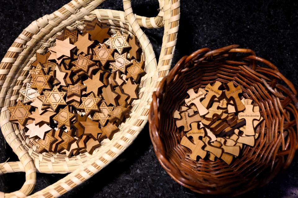 Baskets of wooden Star of David and crosses sit on the counter of Pittsburgh's Calvary Episcopal Church on Thursday, Oct. 26, 2023.