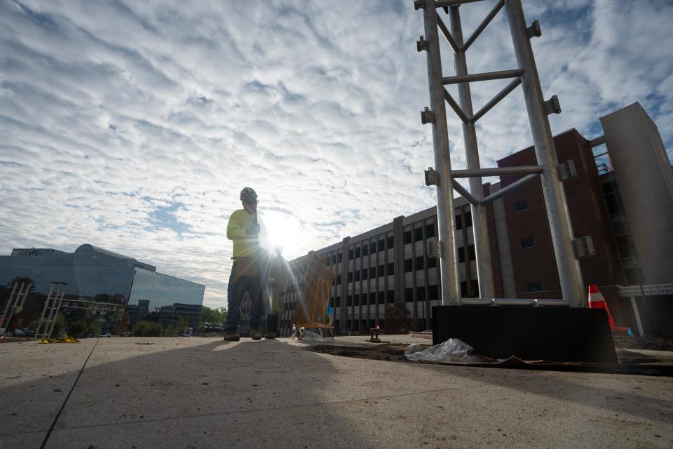 Carpenters for Edward Leske Company install the panels of the Stefan Knapp mural in the courtyard of the of new Valley Hospital in Paramus, NJ on Wednesday Oct. 11, 2023.