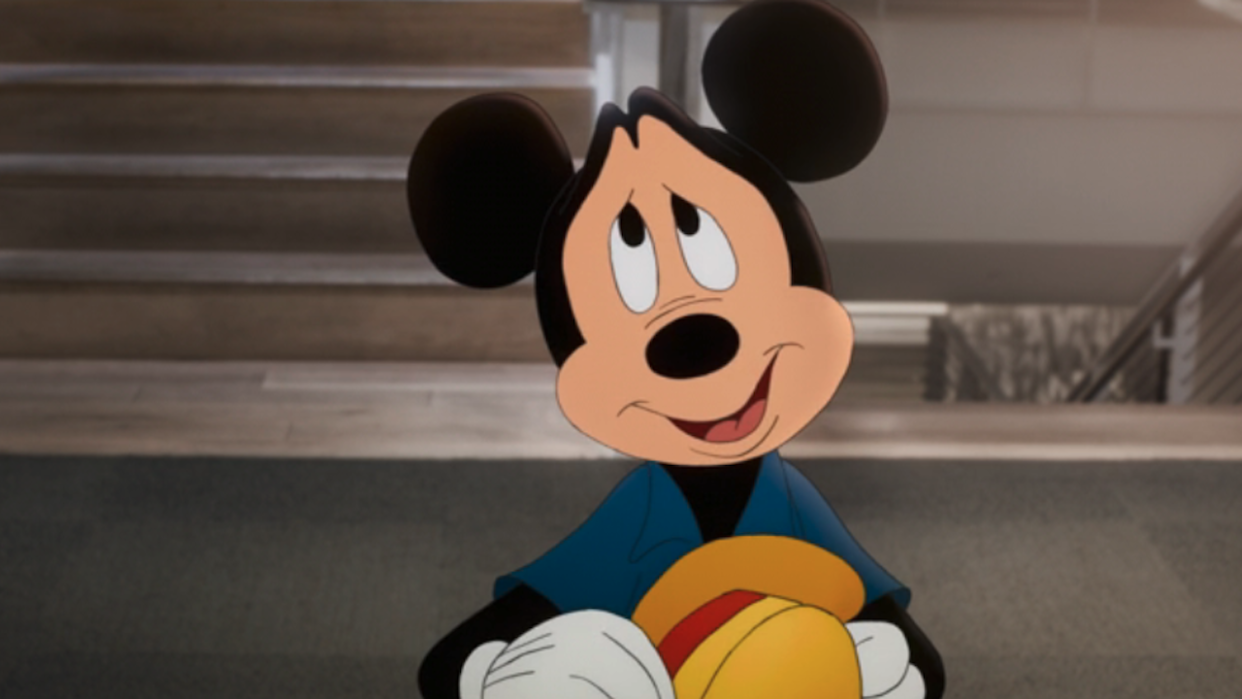  Mickey Mouse looking at Walt Disney in Once Upon A Studio. 