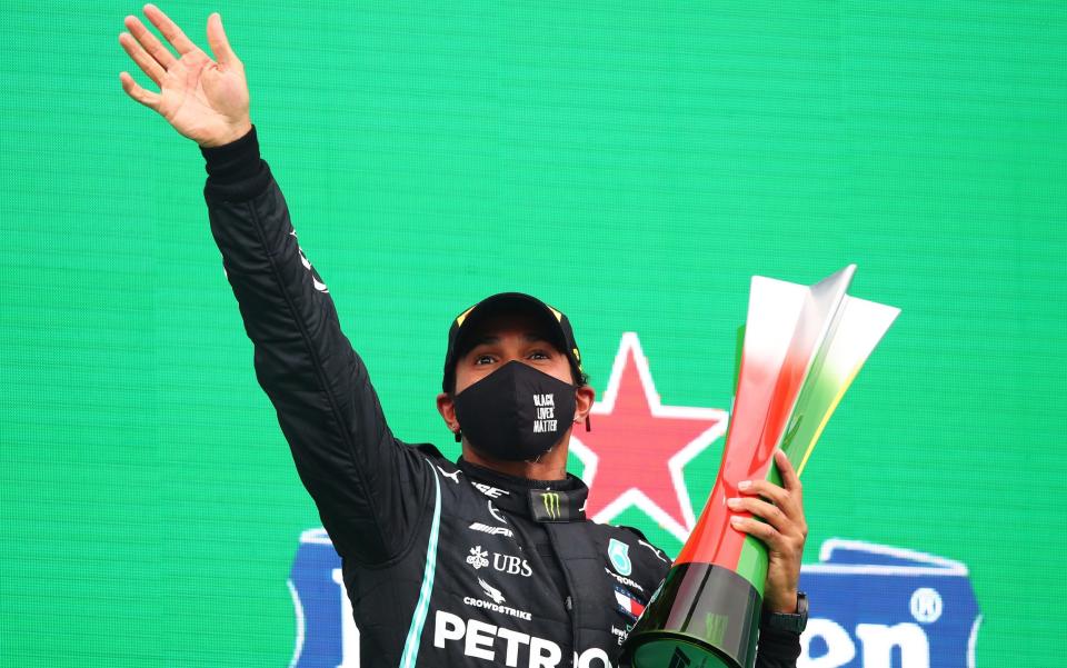 Race winner Lewis Hamilton of Great Britain and Mercedes GP celebrates his record breaking 92nd race win on the podium during the F1 Grand Prix of Portugal at Autodromo Internacional do Algarve on October 25, 2020 in Portimao, Portugal - Getty Images Europe /Joe Portlock 