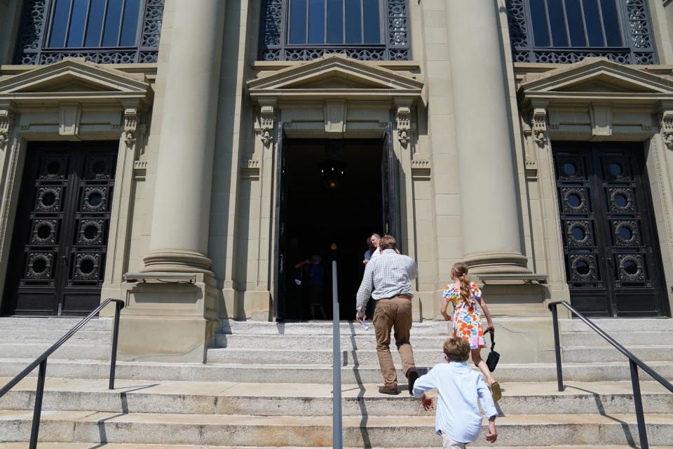 People enter Memorial Hall before Jerry Springer's memorial service Friday, June 9, 2023. 