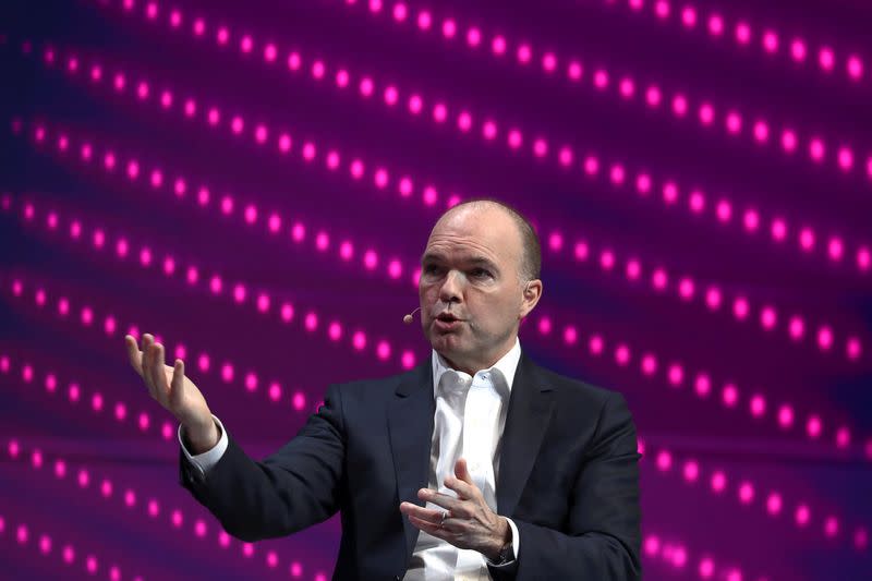 FILE PHOTO: Nick Read, CEO of Vodafone, gestures as he speaks during the Mobile World Congress in Barcelona