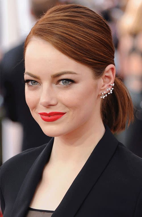 Say what you will about the menswear-inspired Dior blazer and sheer skirt combo Emma Stone sported at the SAG Awards, but her red lip, sleek fiery hair and on-trend Repossi ear cuff were red carpet winners.