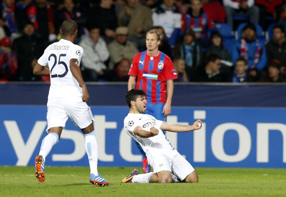 Manchester City's Sergio Aguero (C) celebrates after scoring a goal against Viktoria Plzen during their Champions League group D soccer match at the Doosan Arena in Prague, Czech Republic September 17, 2013. REUTERS/Petr Josek (CZECH REPUBLIC - Tags: SPORT SOCCER)