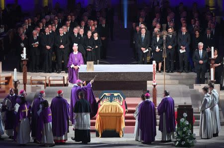 The coffins is blessed with holy water during the pontifical requiem mass for late former German Chancellor Helmut Kohl in the cathedral in Speyer, Germany, July 1, 2017. REUTERS/Arne Dedert/POOL