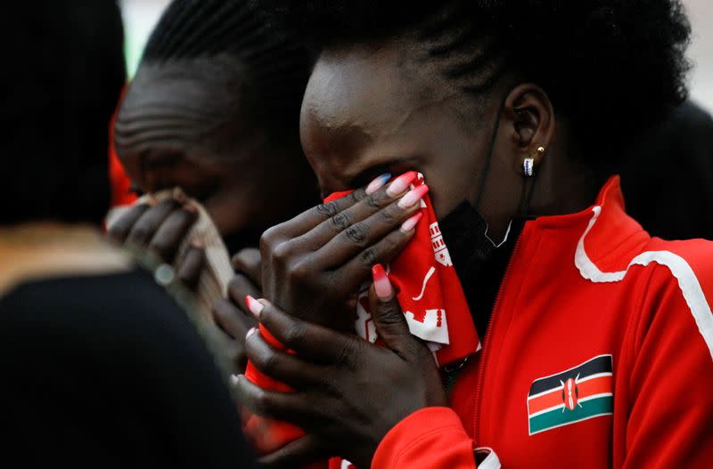 Kenyan athletes mourn during the funeral service of long-distance runner Agnes Tirop in Kapnyamisa village