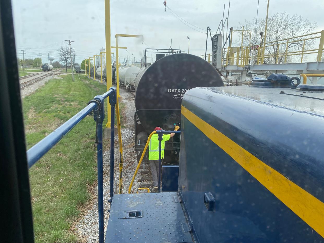 Railroad worker James Day with Columbia Terminal Railroad on April 9 sets a hand brake on a tanker car.