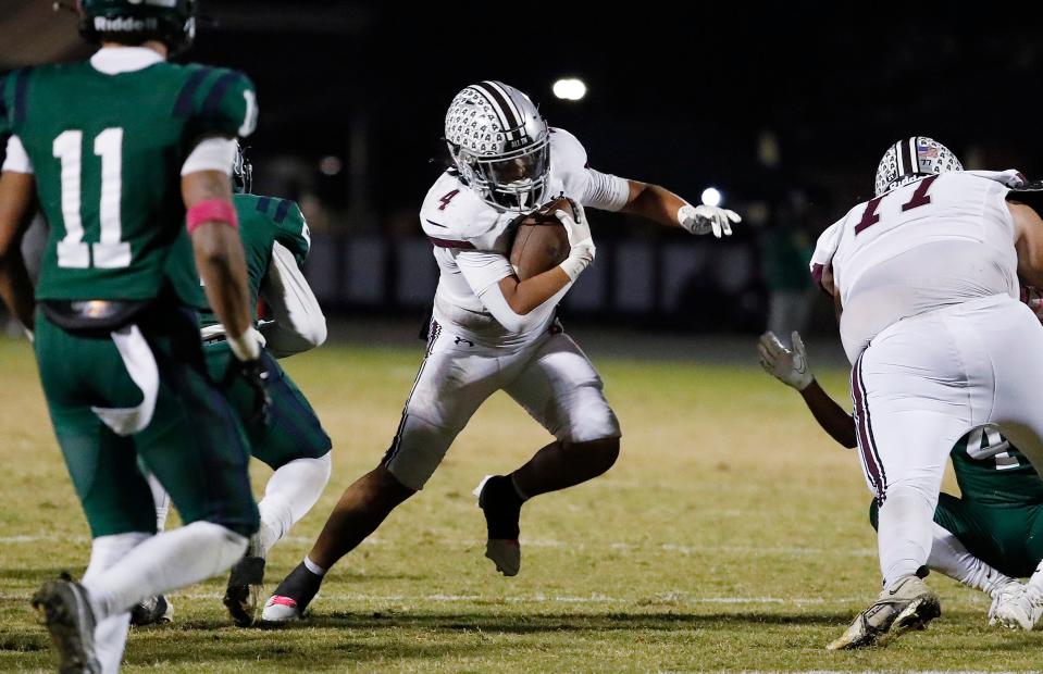 Mt. Whitney's Kysen Sing Galvizo on a run against El Diamante during their high school football game at Visalia Community Stadium in Visalia, Calif., Friday, Oct. 13, 2023.