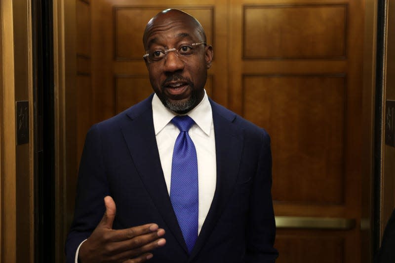 U.S. Sen. Raphael Warnock (D-GA) talks to members of the press as he arrives at the U.S. Capitol for a cloture vote on September 27, 2022, in Washington, DC. The Senate passed a cloture vote of a continuing resolution to fund the government after an oil and gas permitting regulations portion, backed by Sen. Manchin, was removed from the short-term funding bill. 