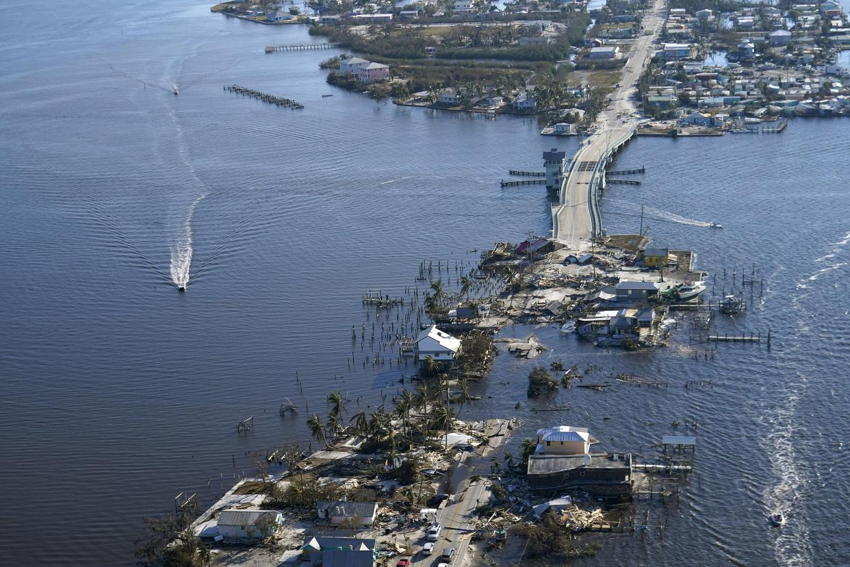 The bridge leading from Fort Myers to Pine Island, Fla., is heavily damaged in the aftermath of Hurricane Ian, Saturday, Oct. 1, 2022. Due to the damage, the island can only be reached by boat or air.